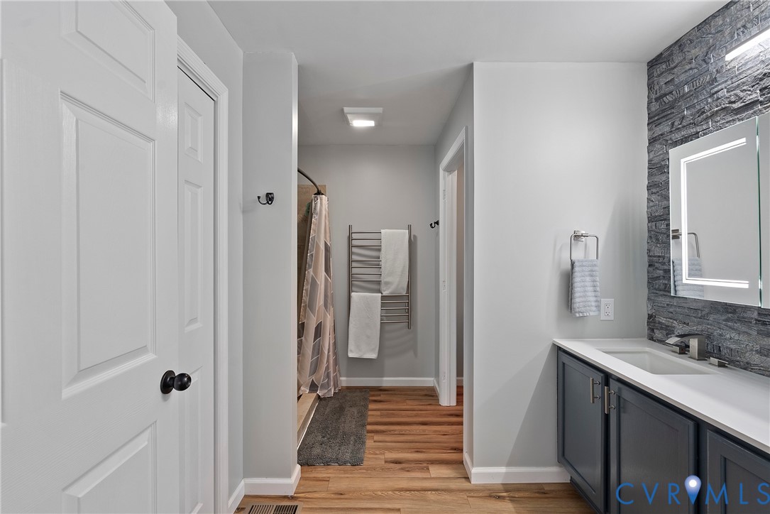 6115 Prospect Road Gloucester, VA 23061 - Photo 28 of 49 a bathroom with a sink and a mirror
