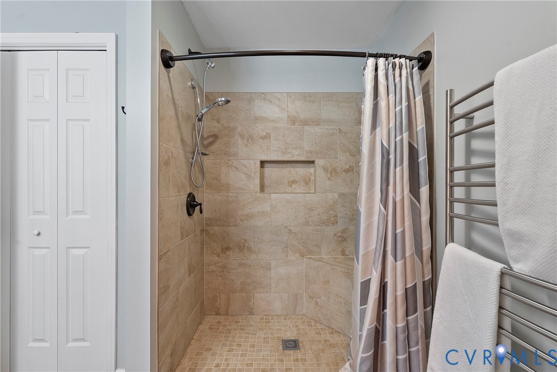 6115 Prospect Road Gloucester, VA 23061 - Photo 31 of 49 a bathroom with a shower and a glass door