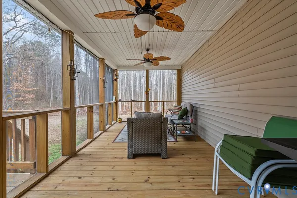 a view of a balcony with furniture