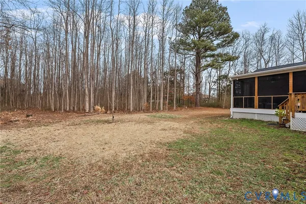 a backyard of a house with barbeque oven