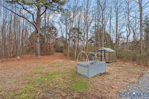 a view of a chairs in a backyard