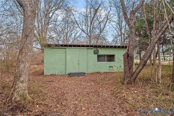 a green field covered with trees
