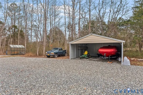 a view of house with garage and yard