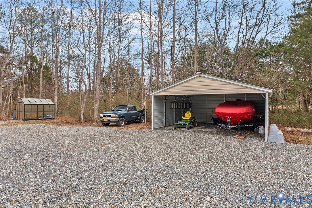 6115 Prospect Road Gloucester, VA 23061 - Photo 47 of 49 a view of a house with a cars park side of a road