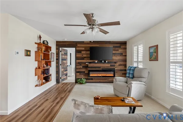 a living room with furniture and a piano