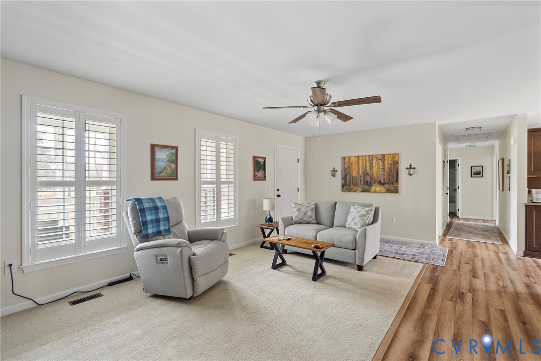 6115 Prospect Road Gloucester, VA 23061 - Photo 8 of 49 a living room with furniture and a wooden floor
