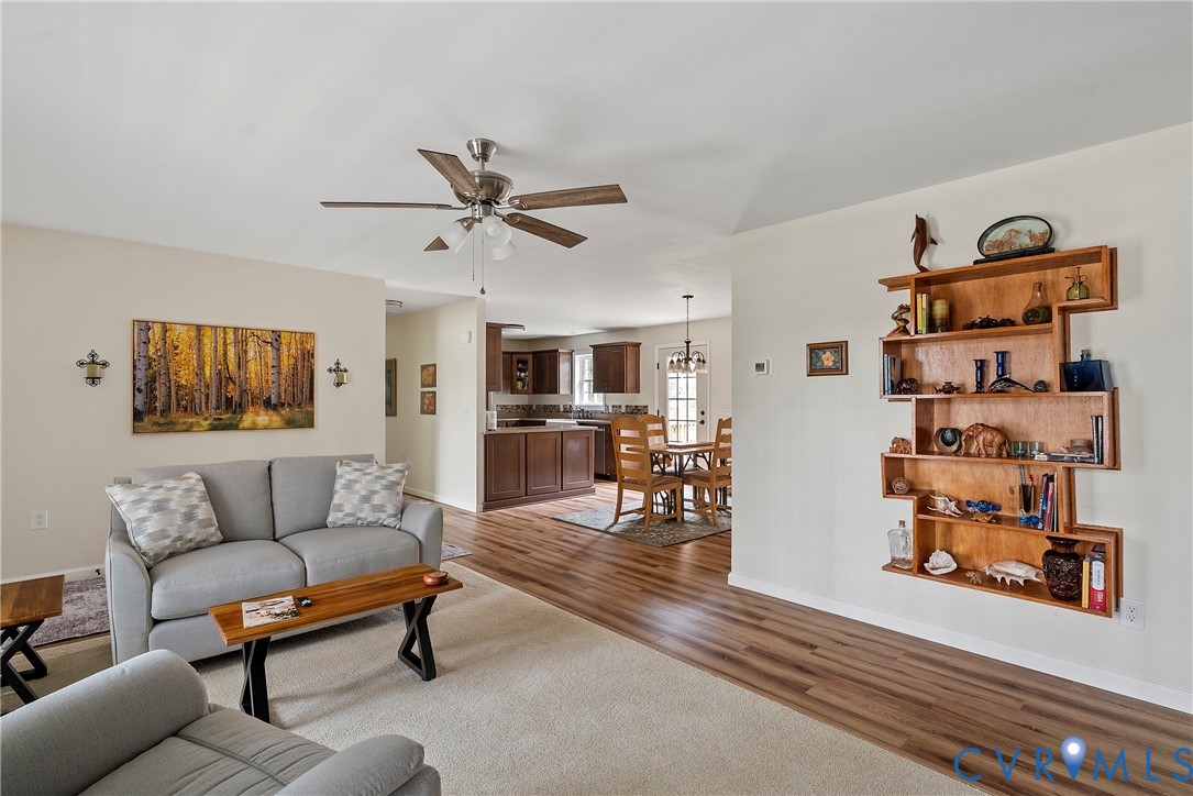 6115 Prospect Road Gloucester, VA 23061 - Photo 9 of 49 a living room with furniture and wooden floor