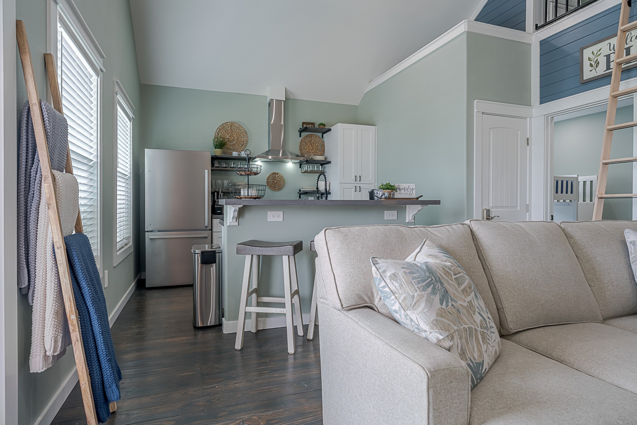 1057 Johnson Road Port Bolivar, TX 77650 - Photo 11 of 40 The open living and kitchen layout keeps everything connected, with vaulted ceilings and a breakfast bar making everyday time together feel effortless.