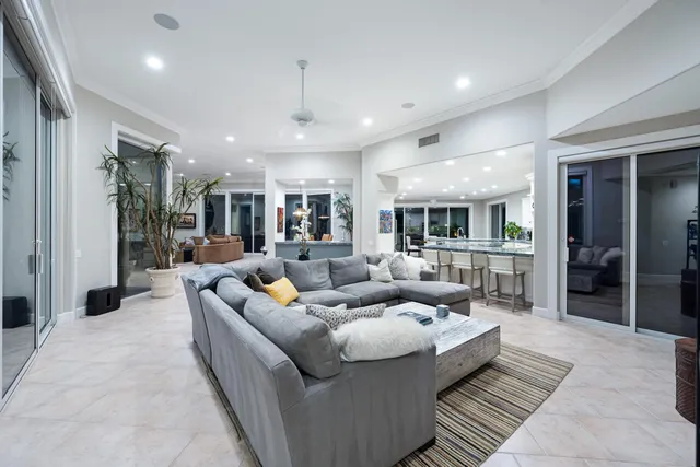 a front view of a house with garden and patio
