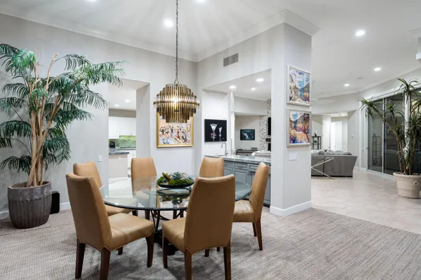 a view of a house with swimming pool and sitting area