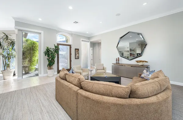 a bathroom with a granite countertop sink a toilet and shower