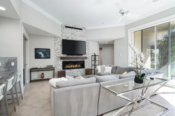 a bathroom with a granite countertop sink a toilet and a mirror