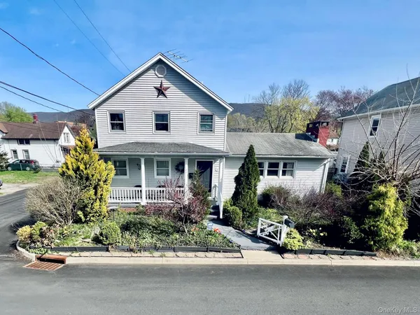 a front view of house with a yard