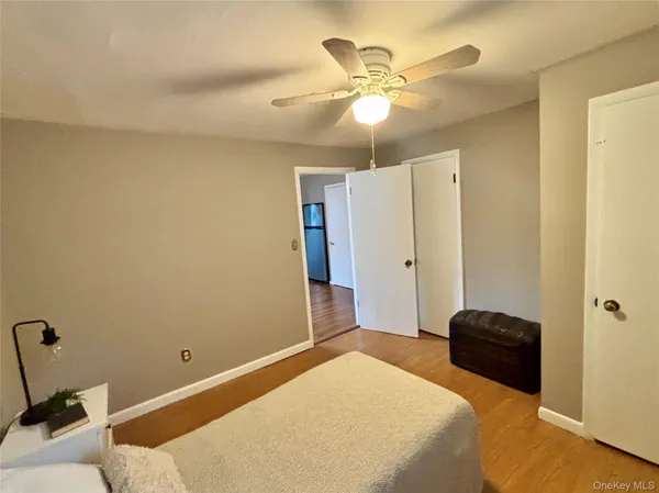 a view of a hallway with wooden floor and a hallway