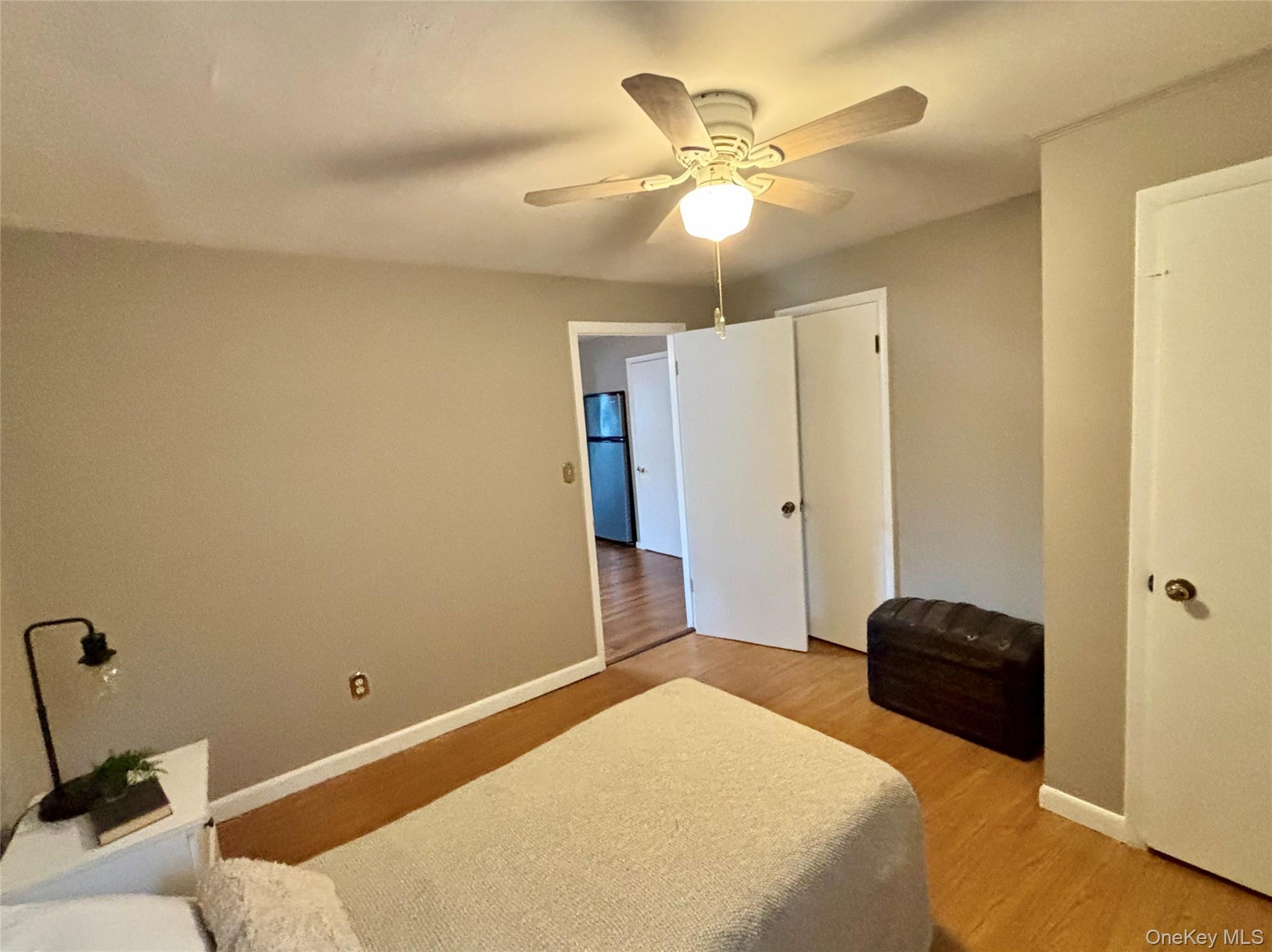 49 North Chestnut Street Beacon, NY 12508 - Photo 11 of 41 Bedroom featuring light wood-type flooring, baseboards, and a ceiling fan