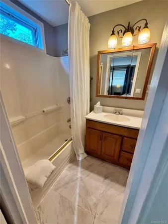 a view of a bathroom from a hallway