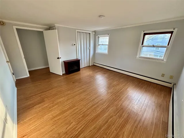 a view of a patio with table and chairs potted plants with wooden fence