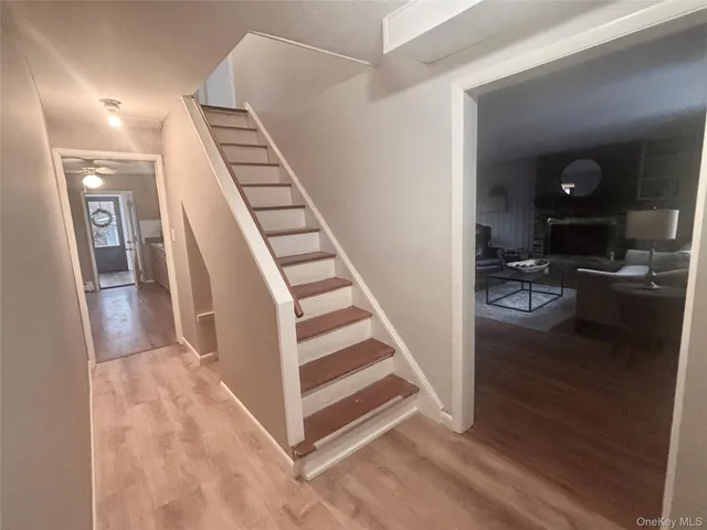 a living room with furniture and a lamp