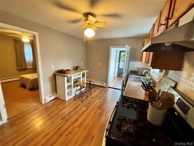 a bathroom with a sink a mirror and a shower
