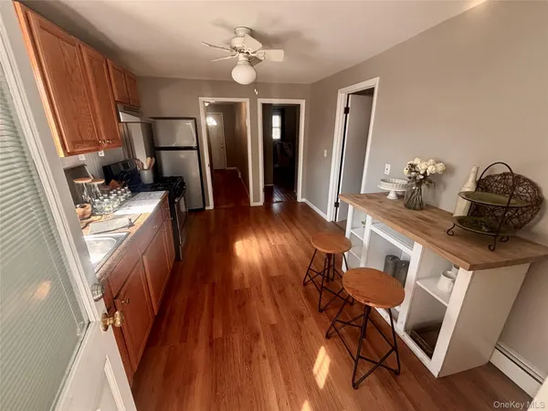a bathroom with a sink a mirror and a shower