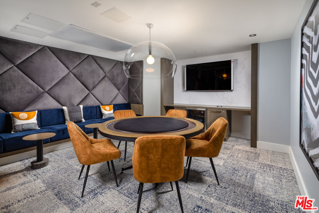 750 South Oxford Avenue, Unit 710 Los Angeles, CA 90005 - Photo 20 of 29 a view of a dining room with furniture and wooden floor