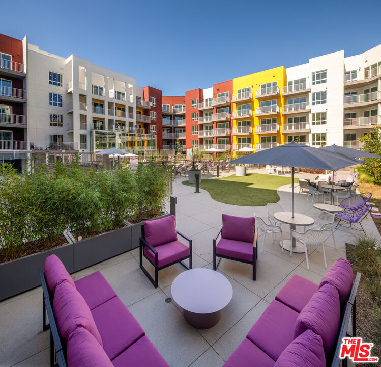 750 South Oxford Avenue, Unit 710 Los Angeles, CA 90005 - Photo 21 of 29 a view of swimming pool with outdoor seating