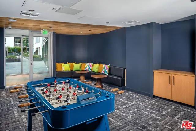 a living room with furniture and a rug