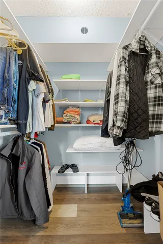 a view of wooden floor and windows in a room