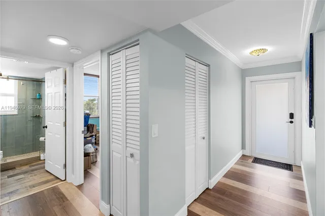 a view of a hallway with windows and stairs