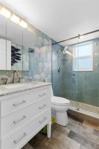 a bathroom with a shower and a toilet