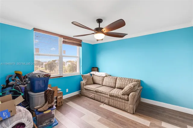 a view of a livingroom with wooden floor