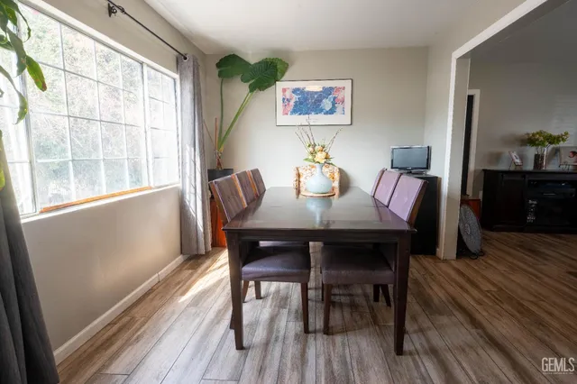 a view of a dining room with furniture window and wooden floor