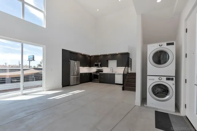 a view of a kitchen with washer and dryer