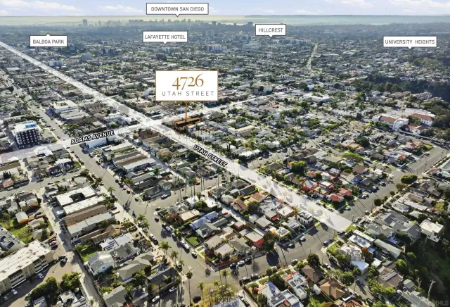 an aerial view of residential building with parking