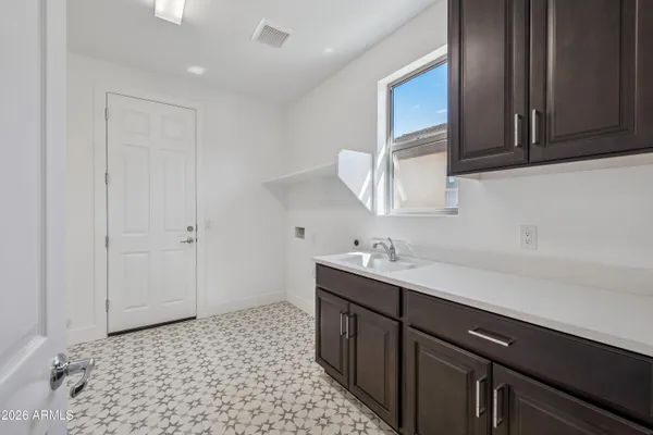 a bathroom with a sink a vanity and a mirror