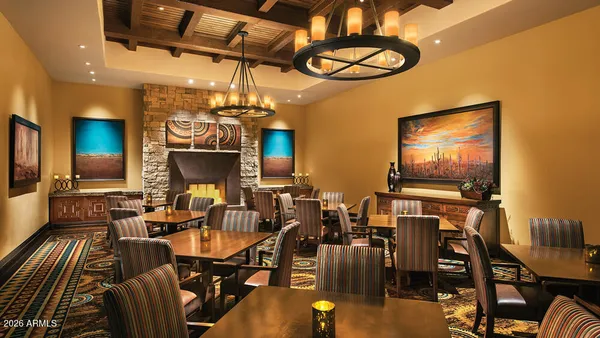 a view of a livingroom with furniture and a flat screen tv