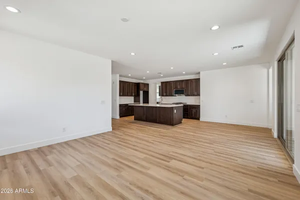 a view of a kitchen with a sink and a stove top oven