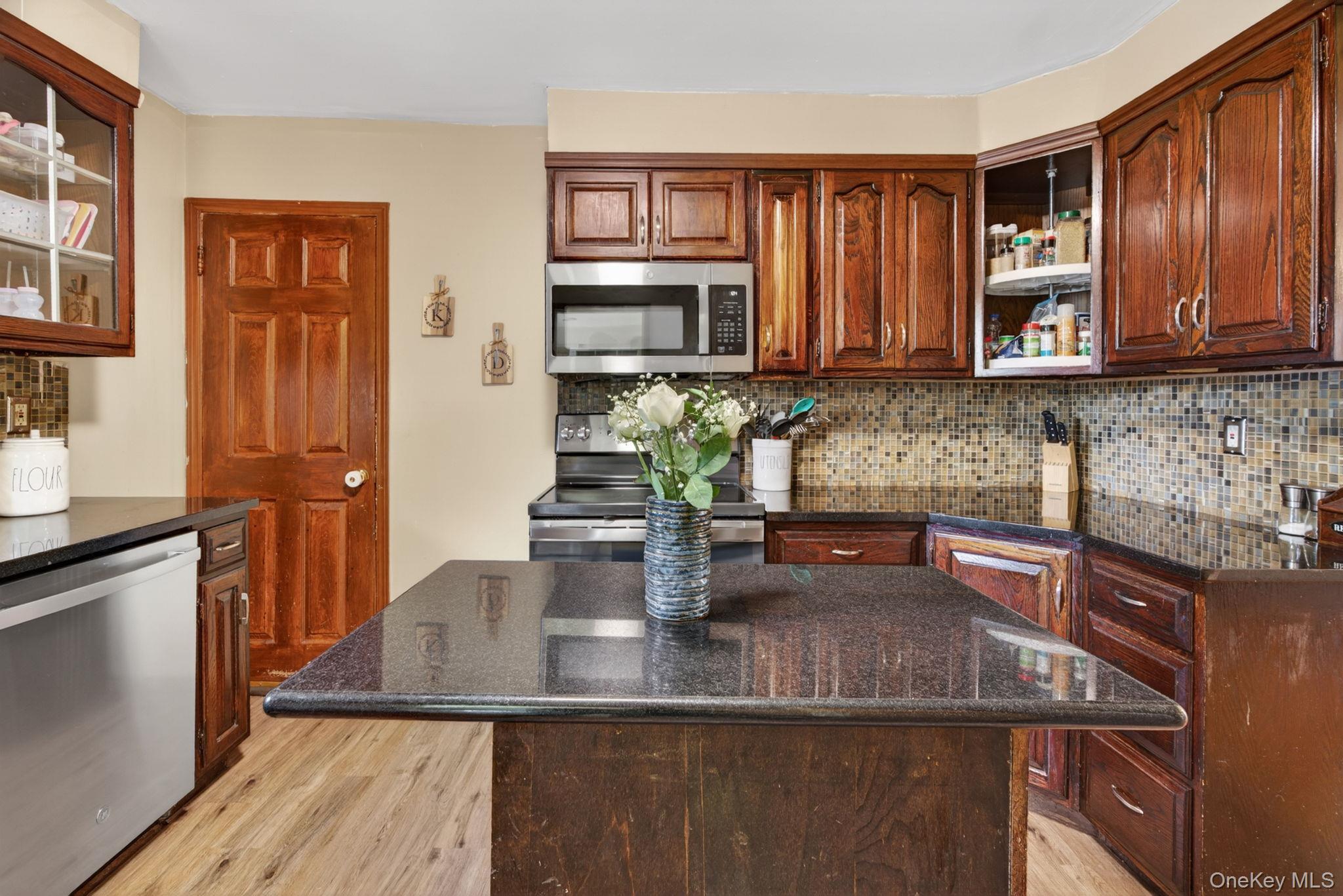 7 Walnut Street Poughkeepsie, NY 12601 - Photo 15 of 30 Blending modern finishes with timeless appeal, this inviting kitchen is sure to be a favorite space in the home.