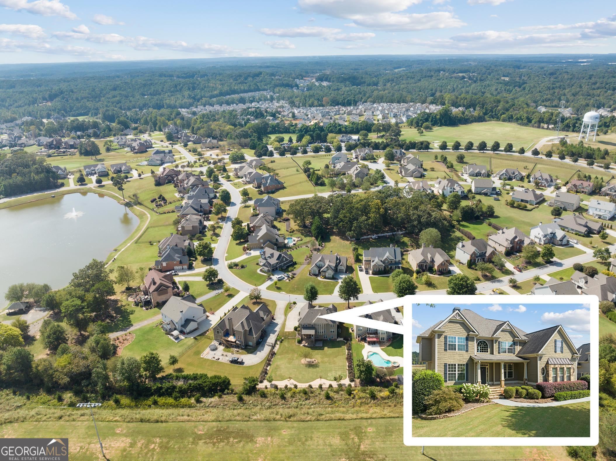 an aerial view of residential houses with outdoor space