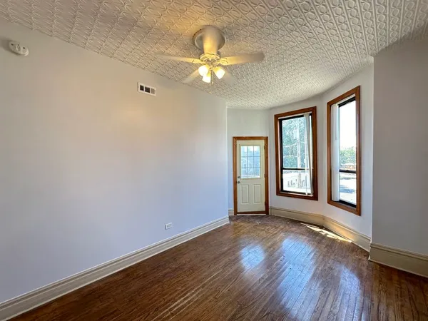 a view of livingroom with window and wooden floor