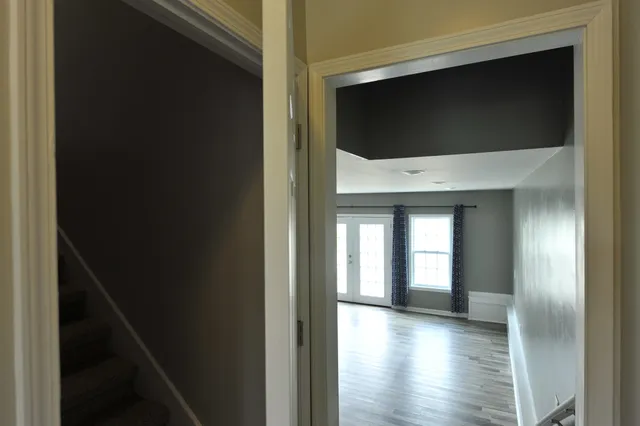 a living room with a flat screen tv and outdoor view