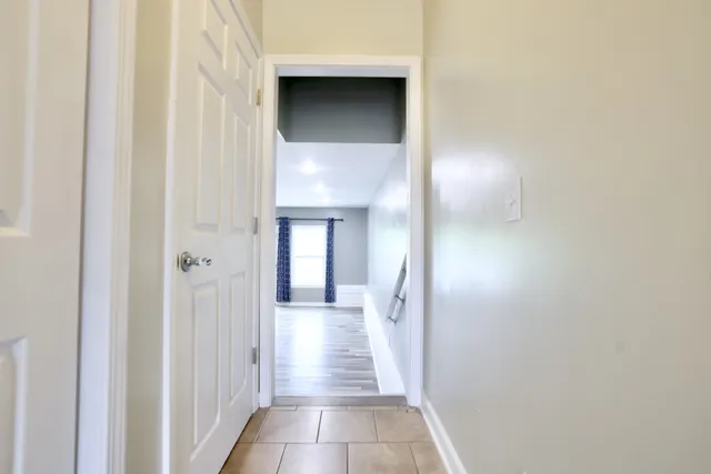 a view of a hallway with a white walls