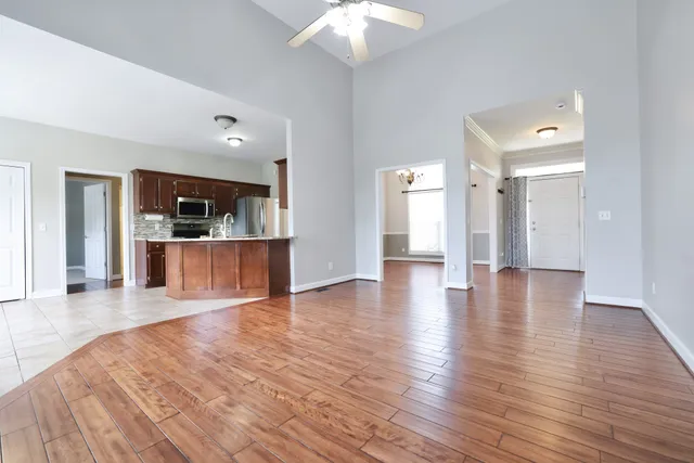 a view of a kitchen with a dishwasher cabinets and wooden floor