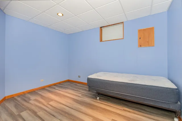 a bathroom with a bathtub and a window