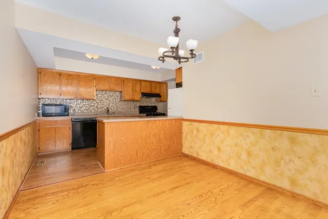 a view of a kitchen with a sink and a kitchen view