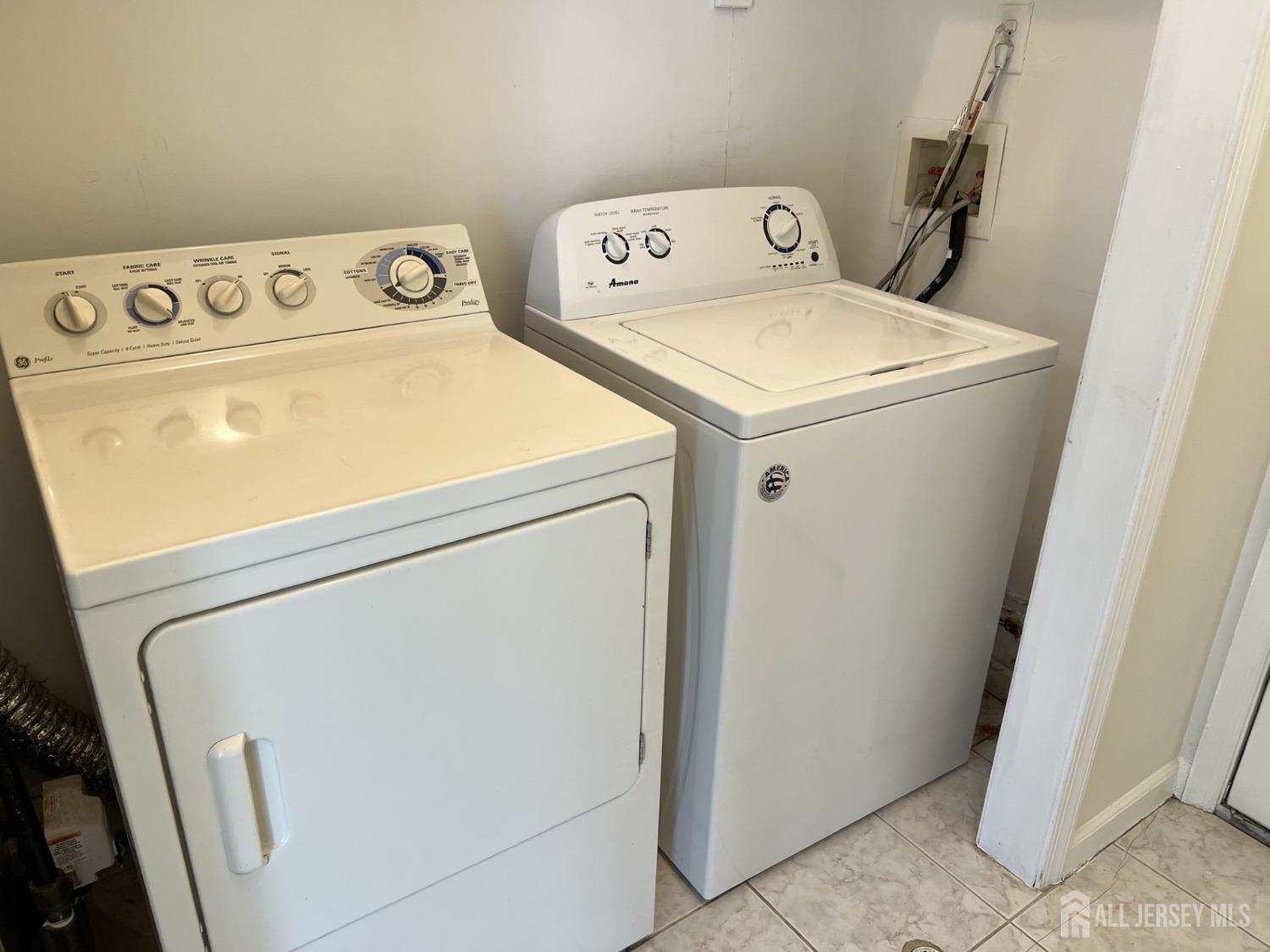 22 North Whittier Street, Unit B Carteret, NJ 07008 - Photo 26 of 27 a utility room with dryer and washer