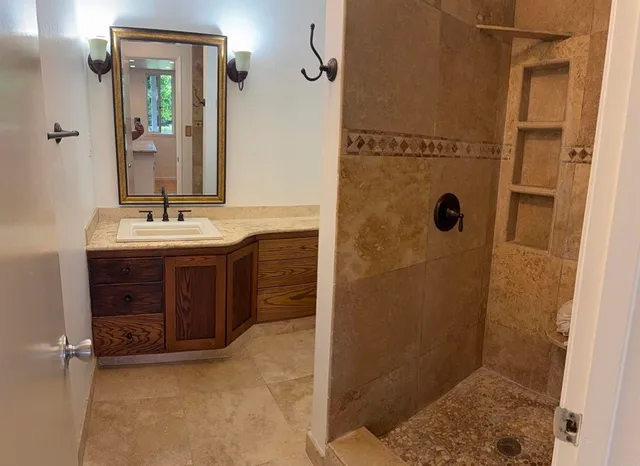 a bathroom with a sink and a mirror