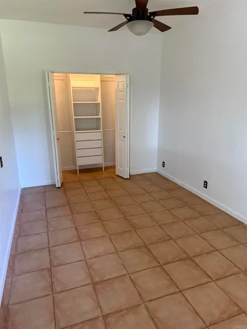 a view of an empty room and a window