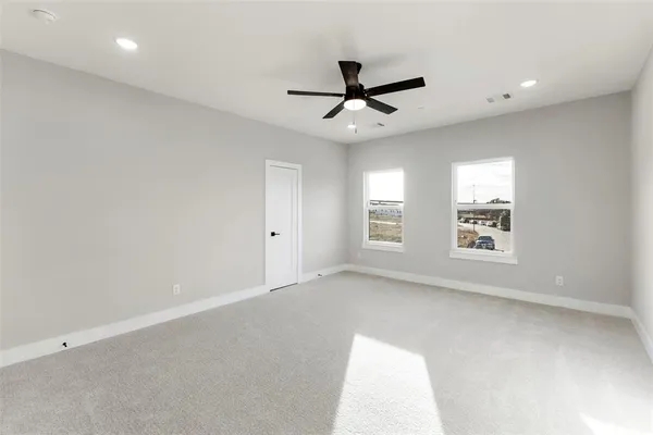a bathroom with a double vanity sink toilet and mirror