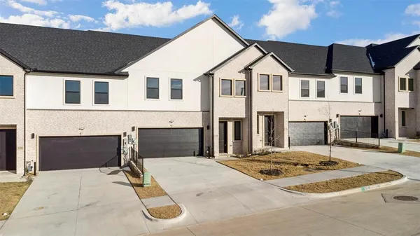 a front view of a house with a garage
